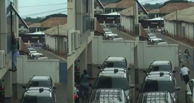 Lady jumps down from window after robbing a bank (video)