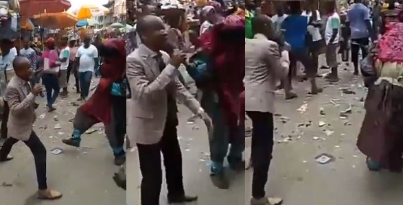 Pastor and masquerade go toe-to-toe while ‘evangelizing’ in market square (Video)