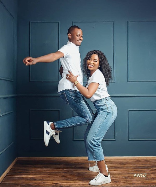 Lady lifts her man like a baby in lovely pre-wedding photos
